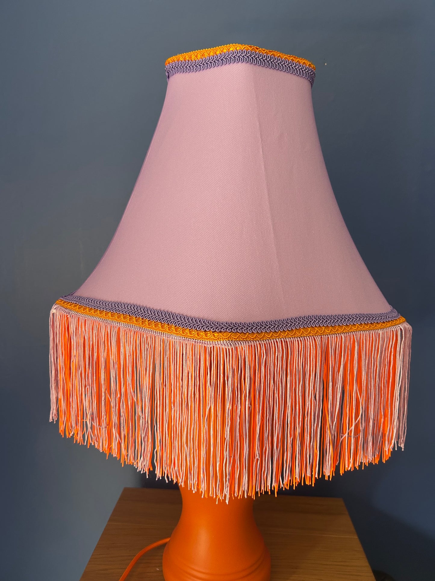 Lilac lampshade with vibrant orange base