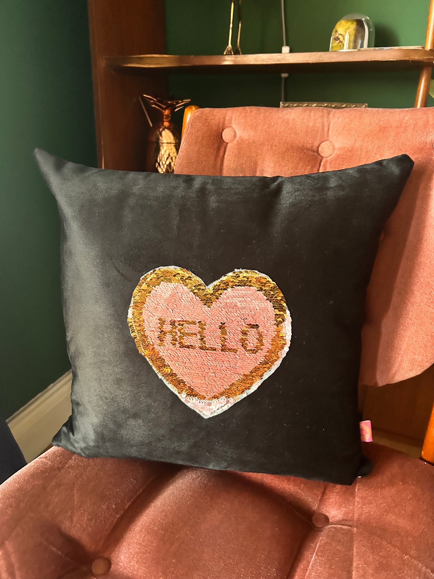 Black velvet cushion with reversible pink and gold sequins
