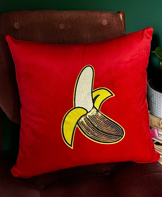 Red velvet cushion with large banana