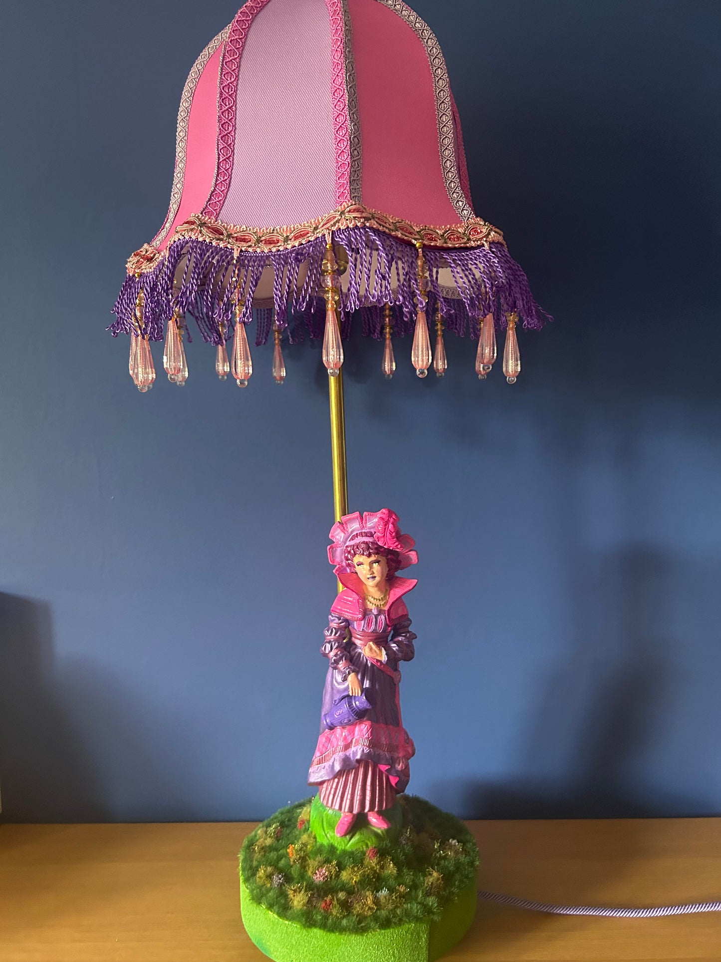 Figurine lamps with colourful scalloped lampshades