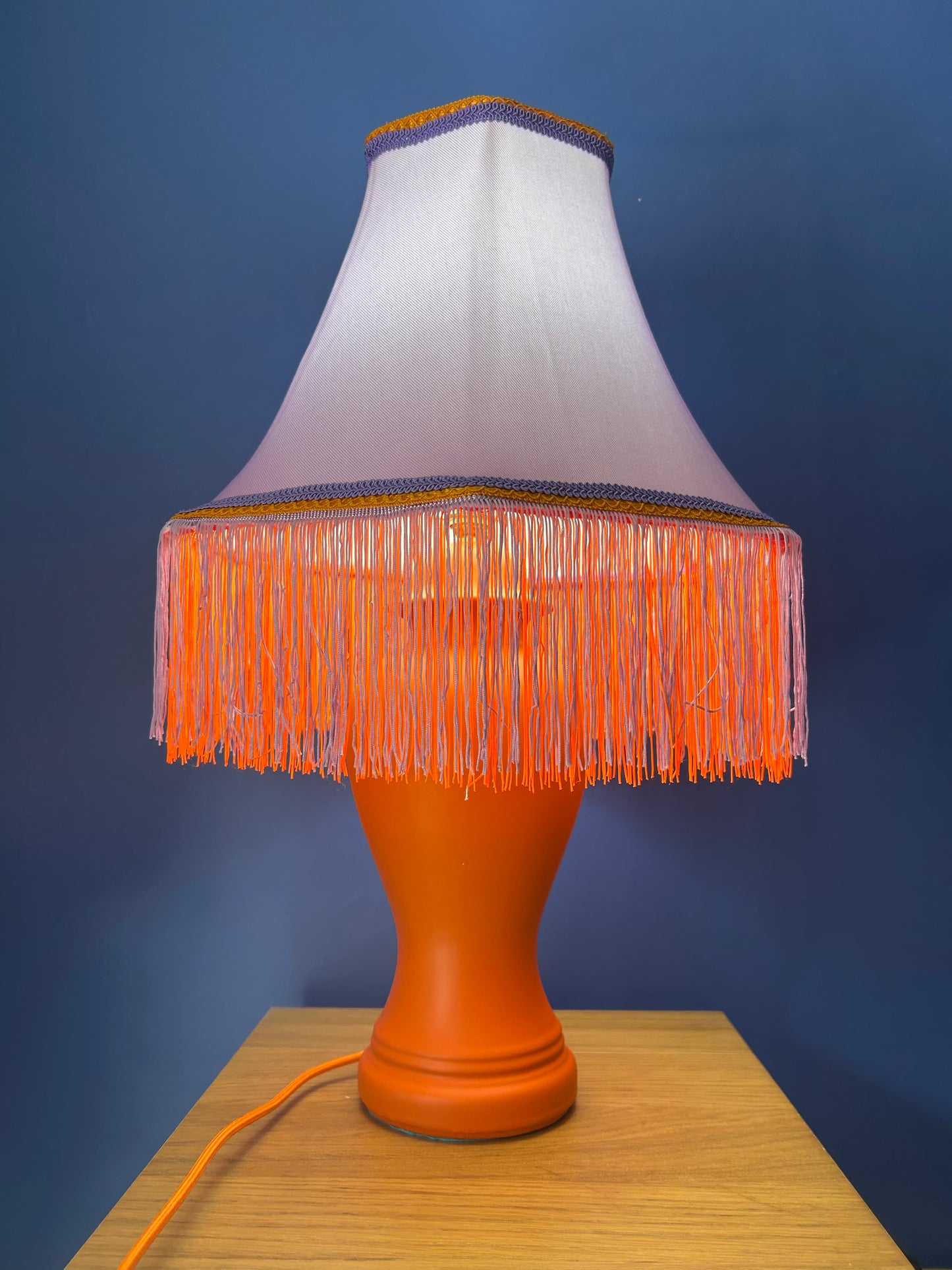 Lilac lampshade with vibrant orange base