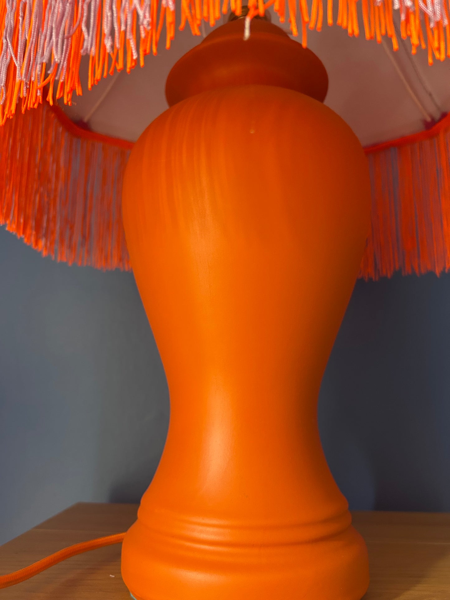 Lilac lampshade with vibrant orange base
