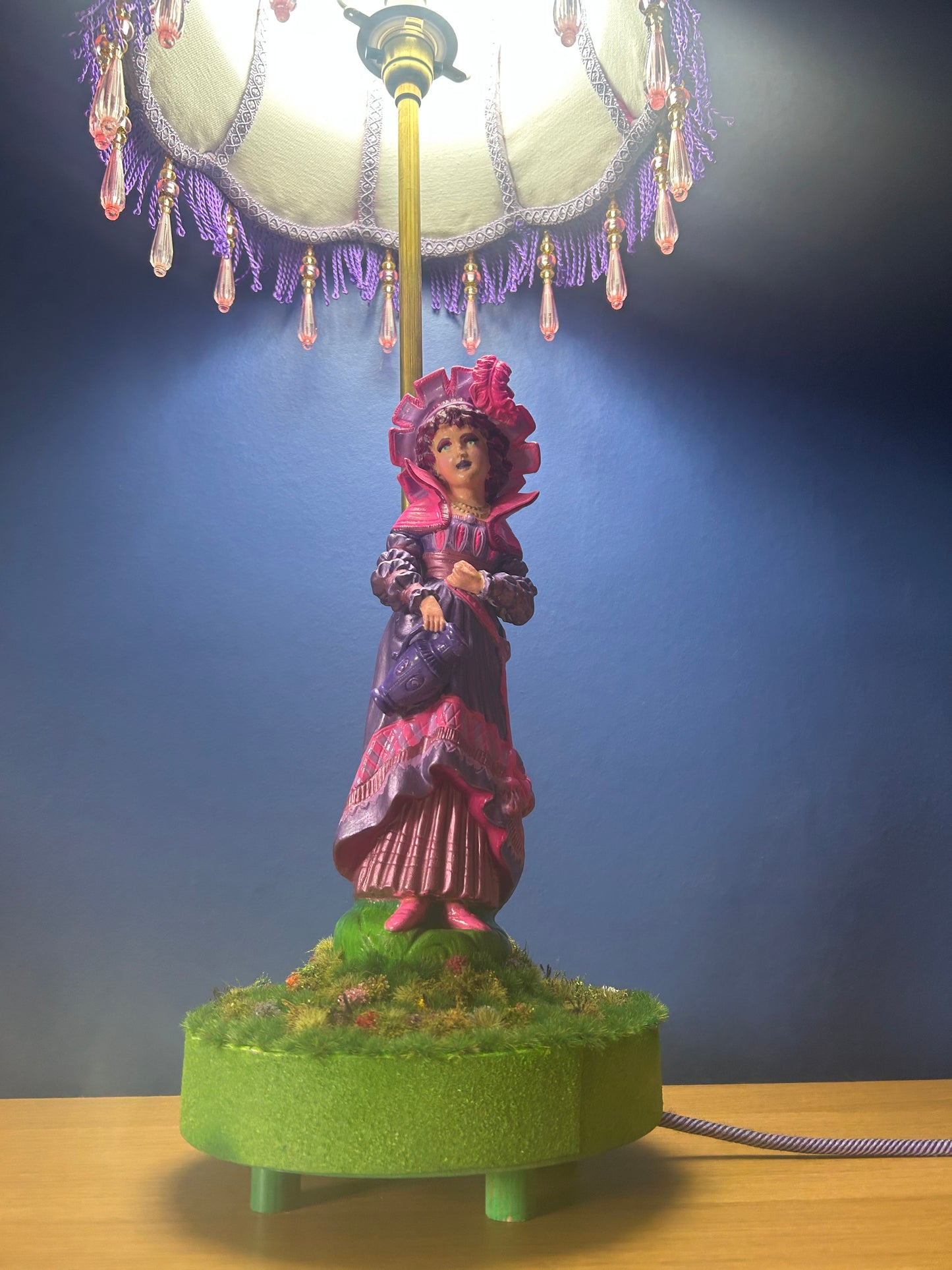 Figurine lamps with colourful scalloped lampshades