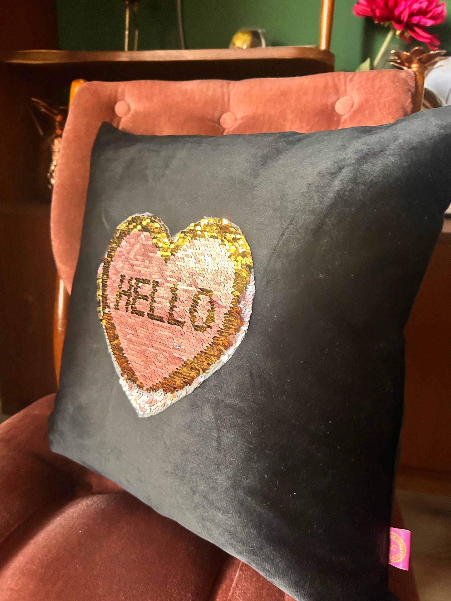 Black velvet cushion with reversible pink and gold sequins