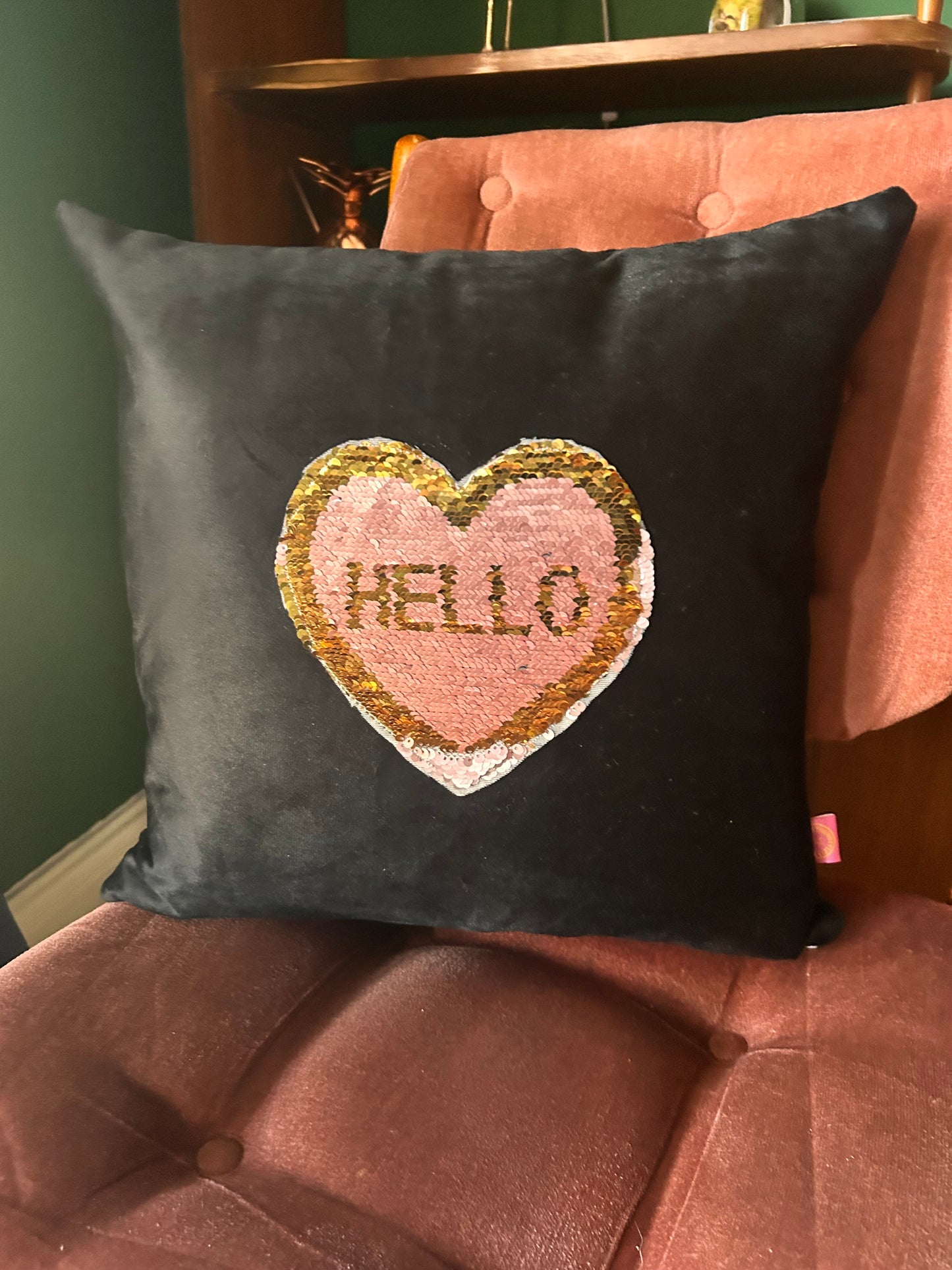 Black velvet cushion with reversible pink and gold sequins