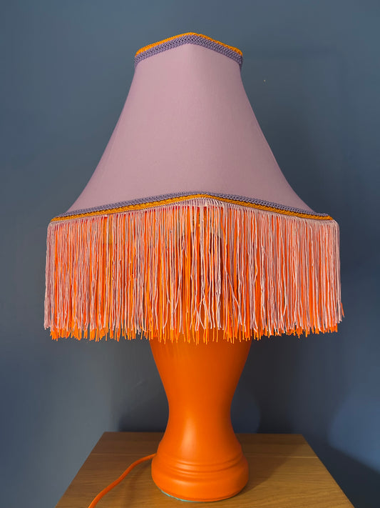 Lilac lampshade with vibrant orange base