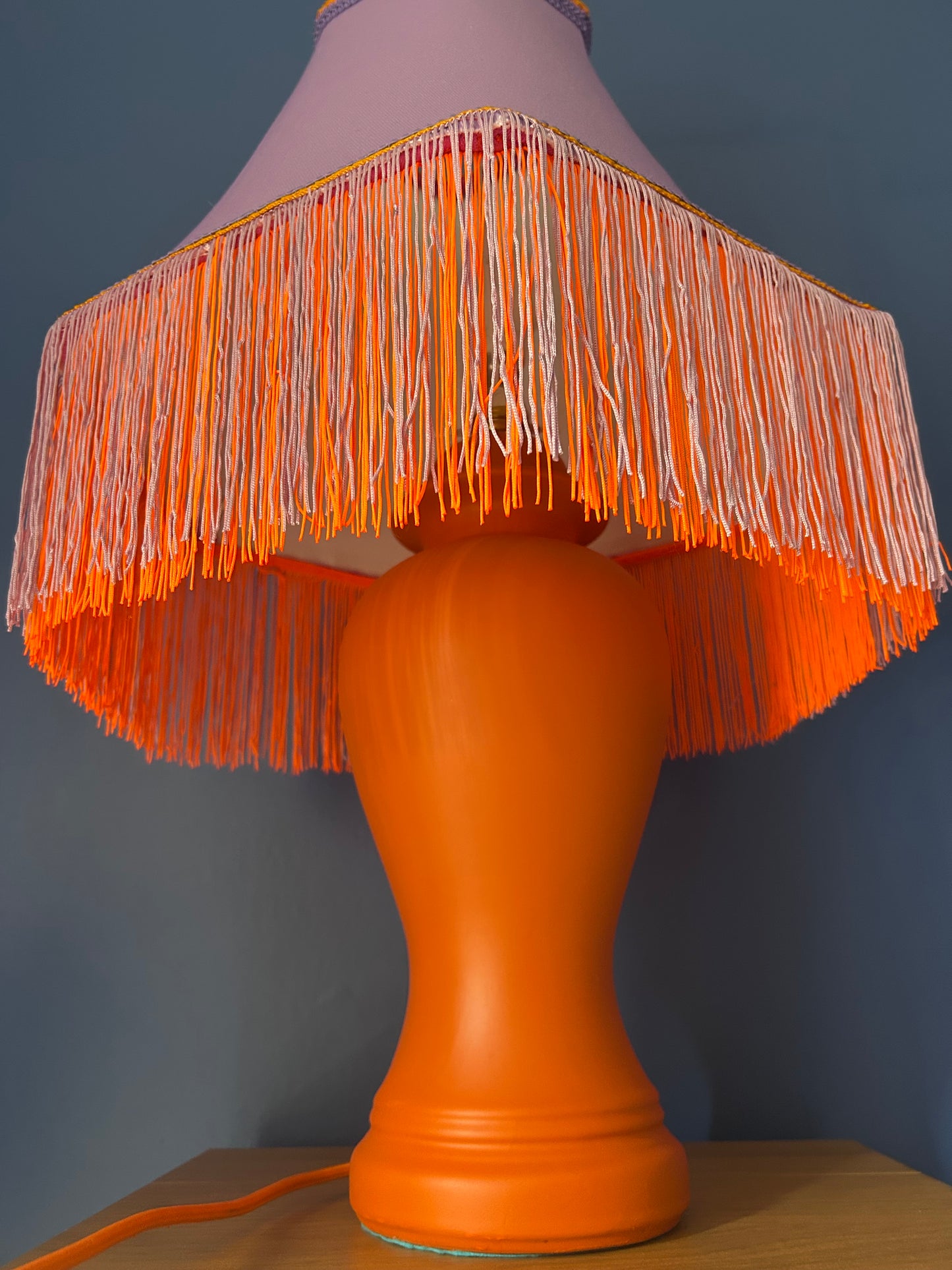 Lilac lampshade with vibrant orange base